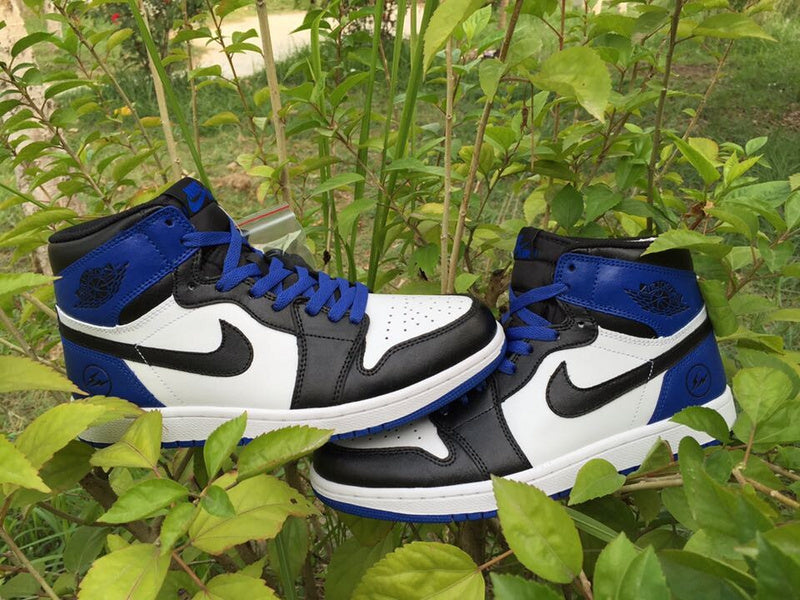 Jordan 1 High Sneakers in Black, in White and Royal Blue - product image from the listing.