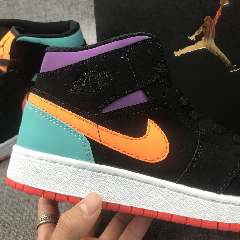 Jordan 1 Mid Sneakers in Multicolor Black 554725-083 - product image from the listing.
