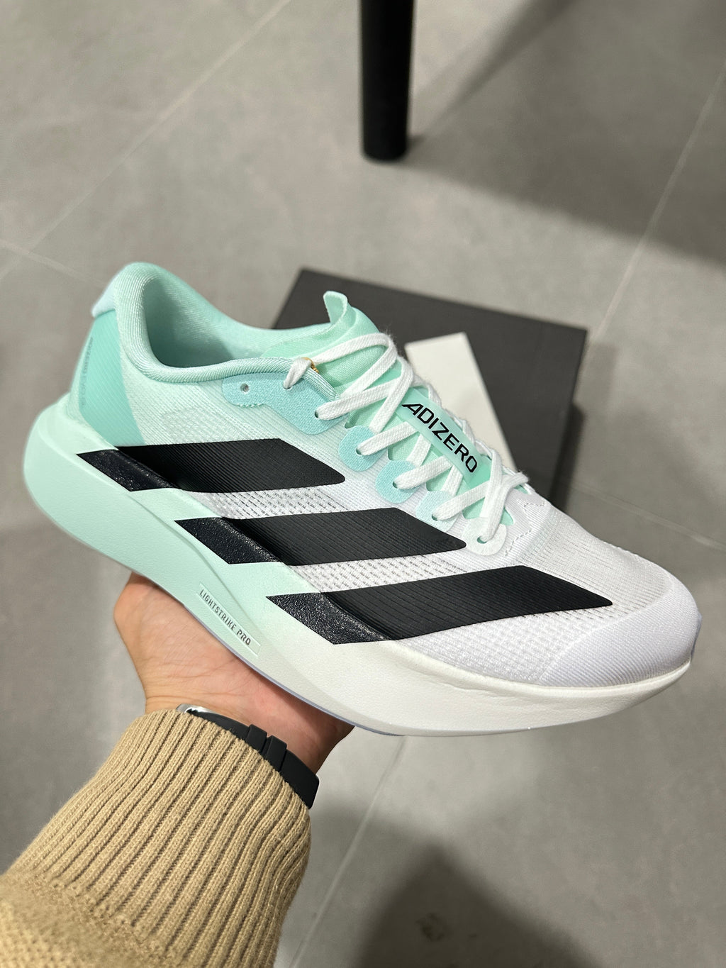 White and Mint adidas Adizero Lightweight Running Shoes - product image from the listing.