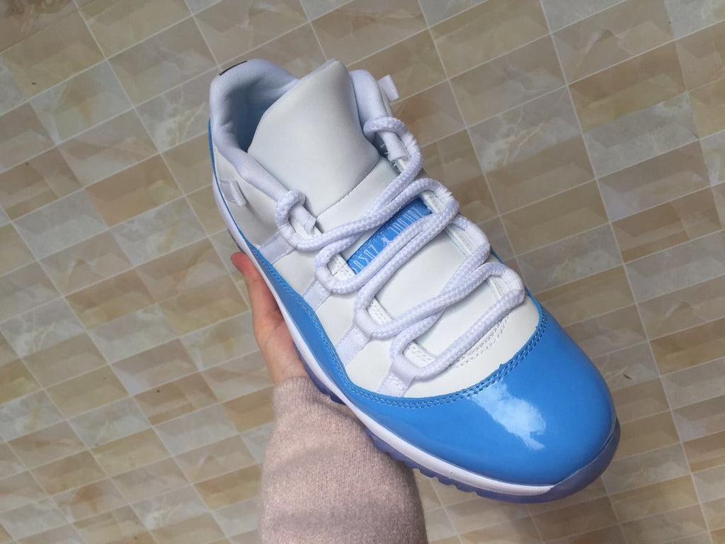 White and University Blue Jordan 11 Low Sneakers - product image from the listing.