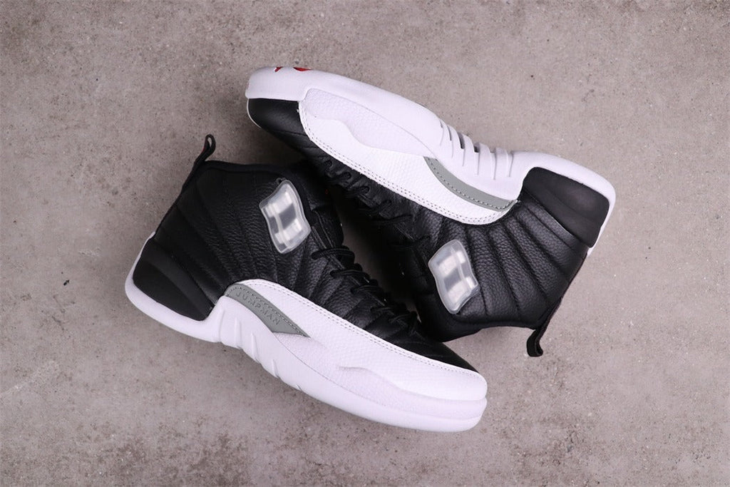 Air Jordan 12 Reverse Taxi Black White 130690-001 - product image from the listing.