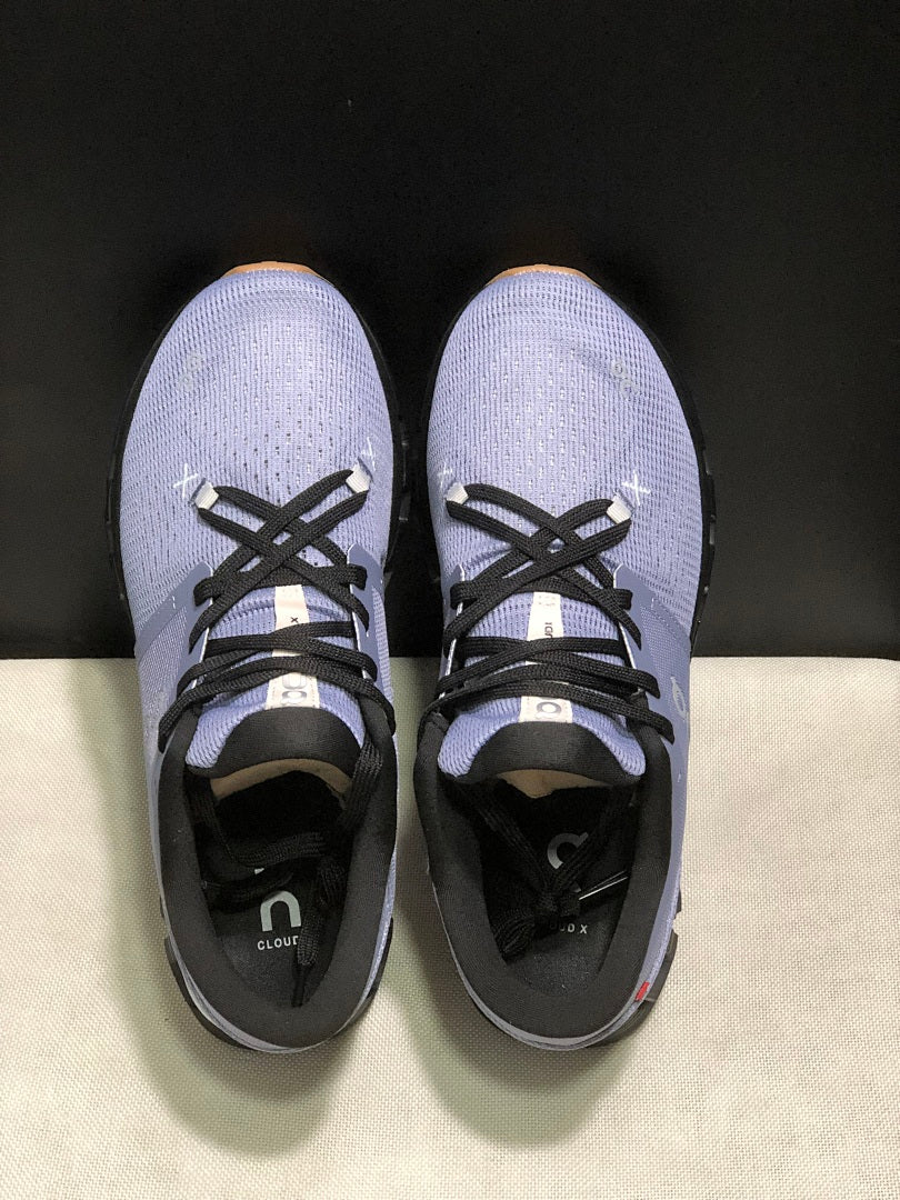 On Cloud X 4 Sneakers in Feather in Black - product image from the listing.