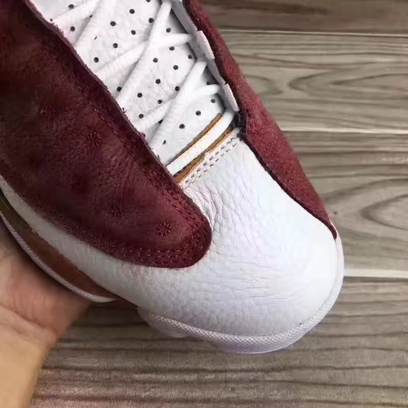 Jordan 13 Sneakers in Burgundy Brown White - product image from the listing.