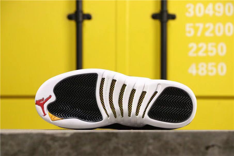 Air Jordan 12 Reverse Taxi Sneakers Black 153265-017 - product image from the listing.
