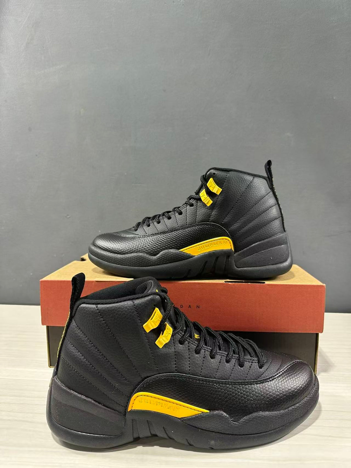 Air Jordan 12 Retro Black Taxi Sneakers CT8013-071 - product image from the listing.