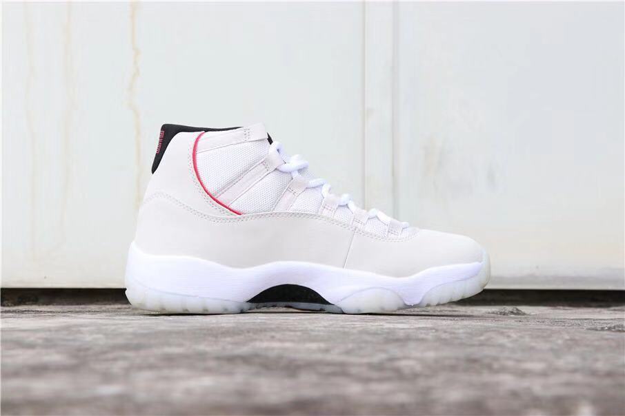 Air Jordan 11 Platinum Tint White High-Top Sneakers - product image from the listing.