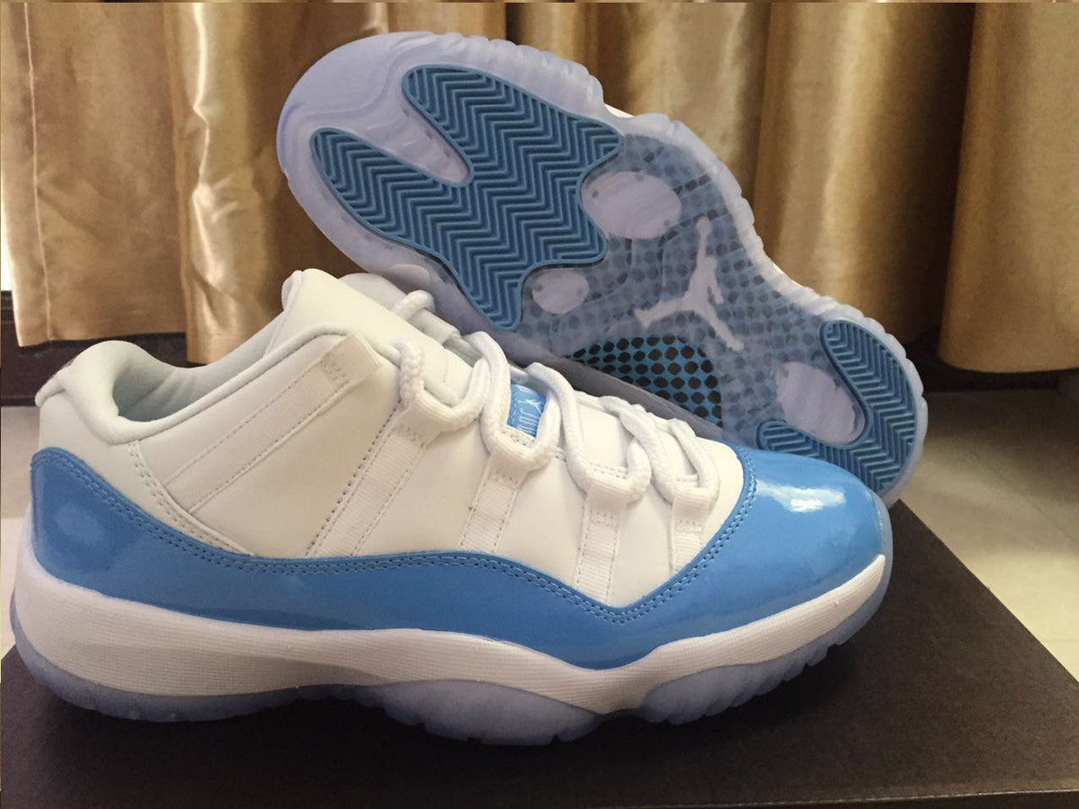 White and University Blue Jordan 11 Low Sneakers - product image from the listing.