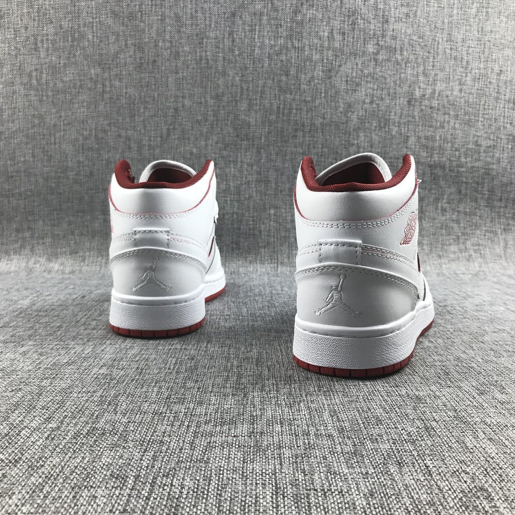 Air Jordan 1 Mid Sneakers in White and Red 554725-103 - product image from the listing.