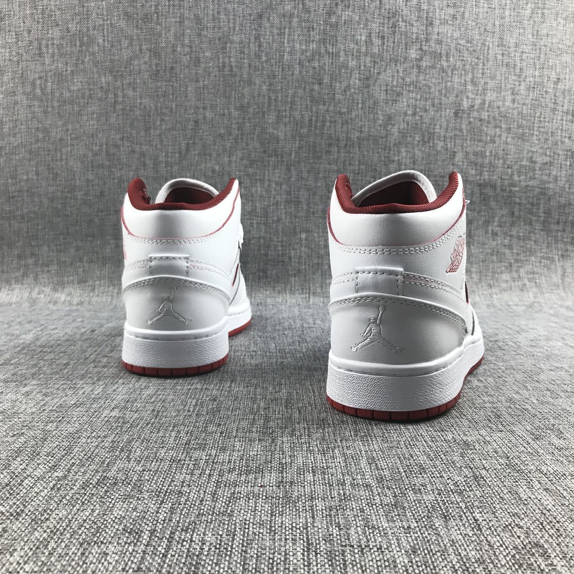 Air Jordan 1 Mid Sneakers in White and Red 554725-103 - product image from the listing.