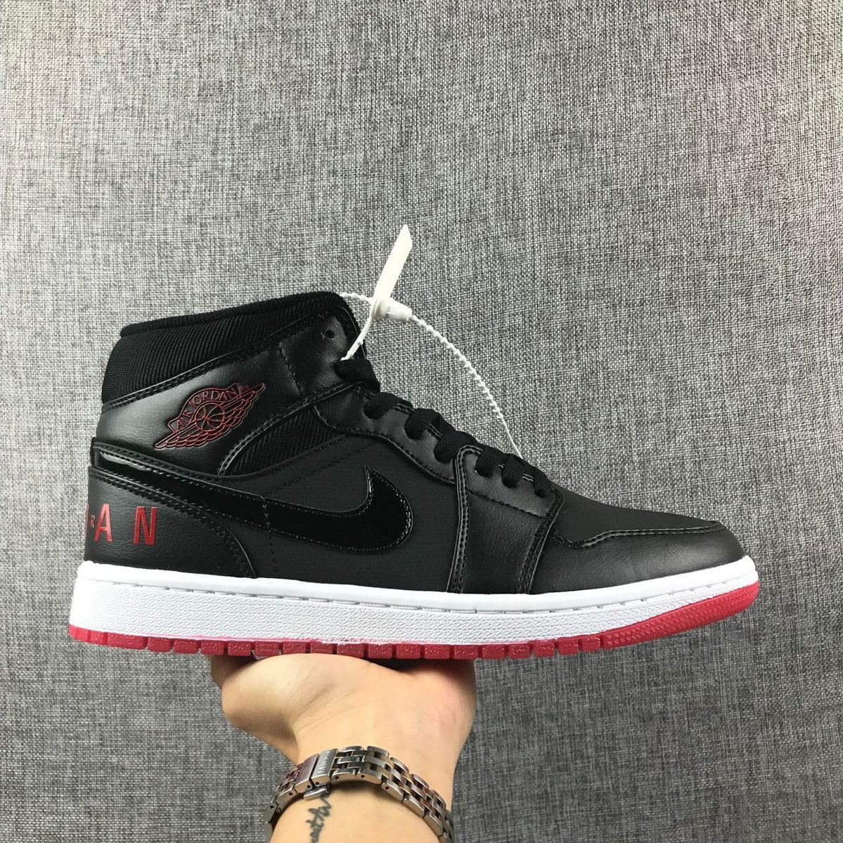 Air Jordan 1 Mid High-Top Sneakers in Black Red White - product image from the listing.