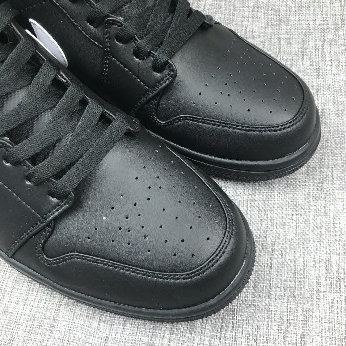 Air Jordan 1 Mid Sneakers in Black White 554724-049 - product image from the listing.