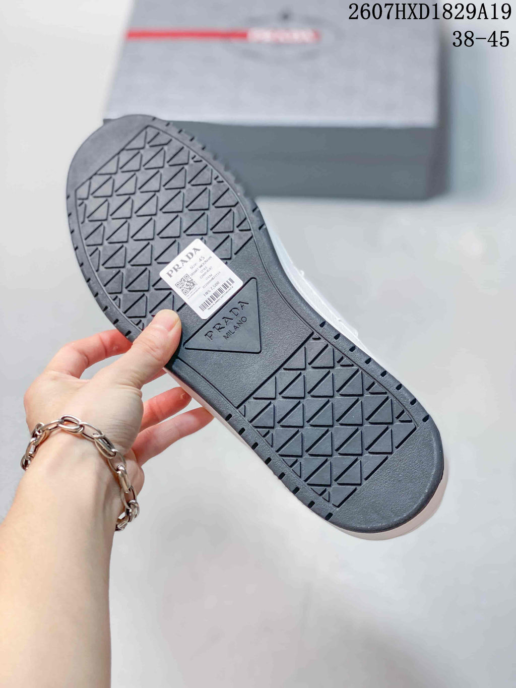 Prada Downtown Low-Top Sneakers in White Leather 2607HXD1829A19 - product image from the listing.