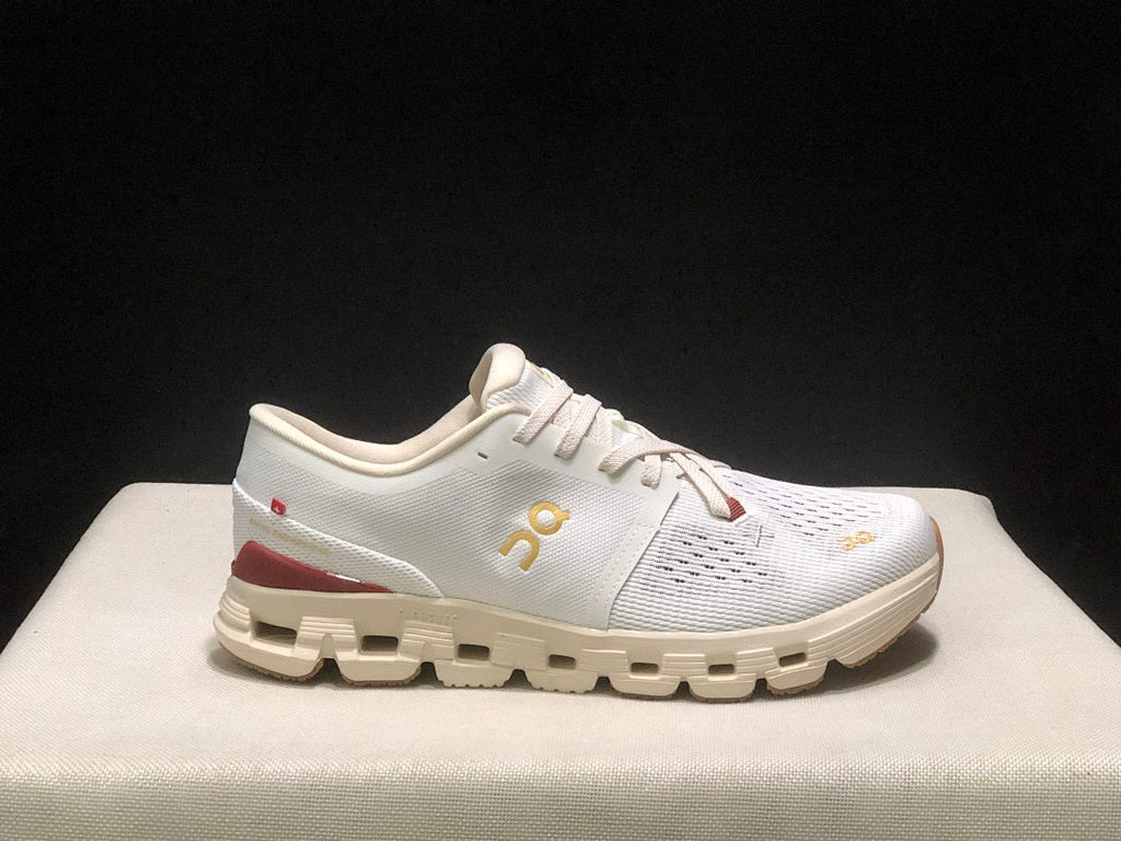 On Cloud X 4 Year of the Snake Sneakers in Ivory Cream - product image from the listing.