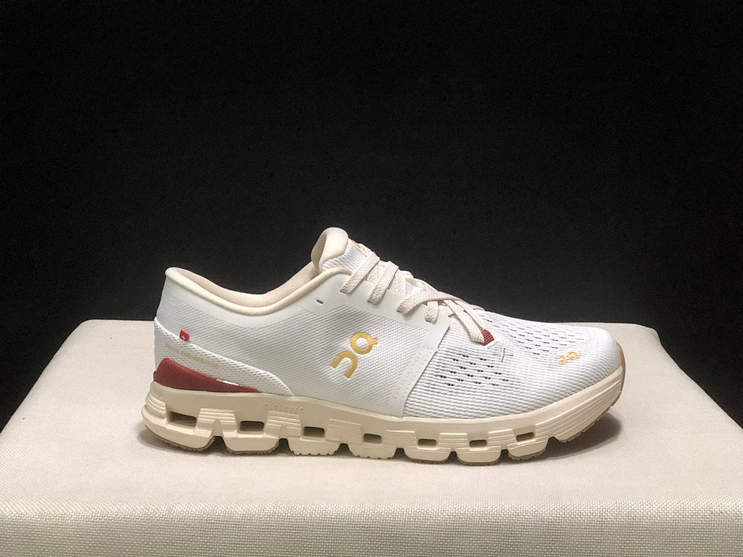 On Cloud X 4 Year of the Snake Sneakers in Ivory Cream - product image from the listing.