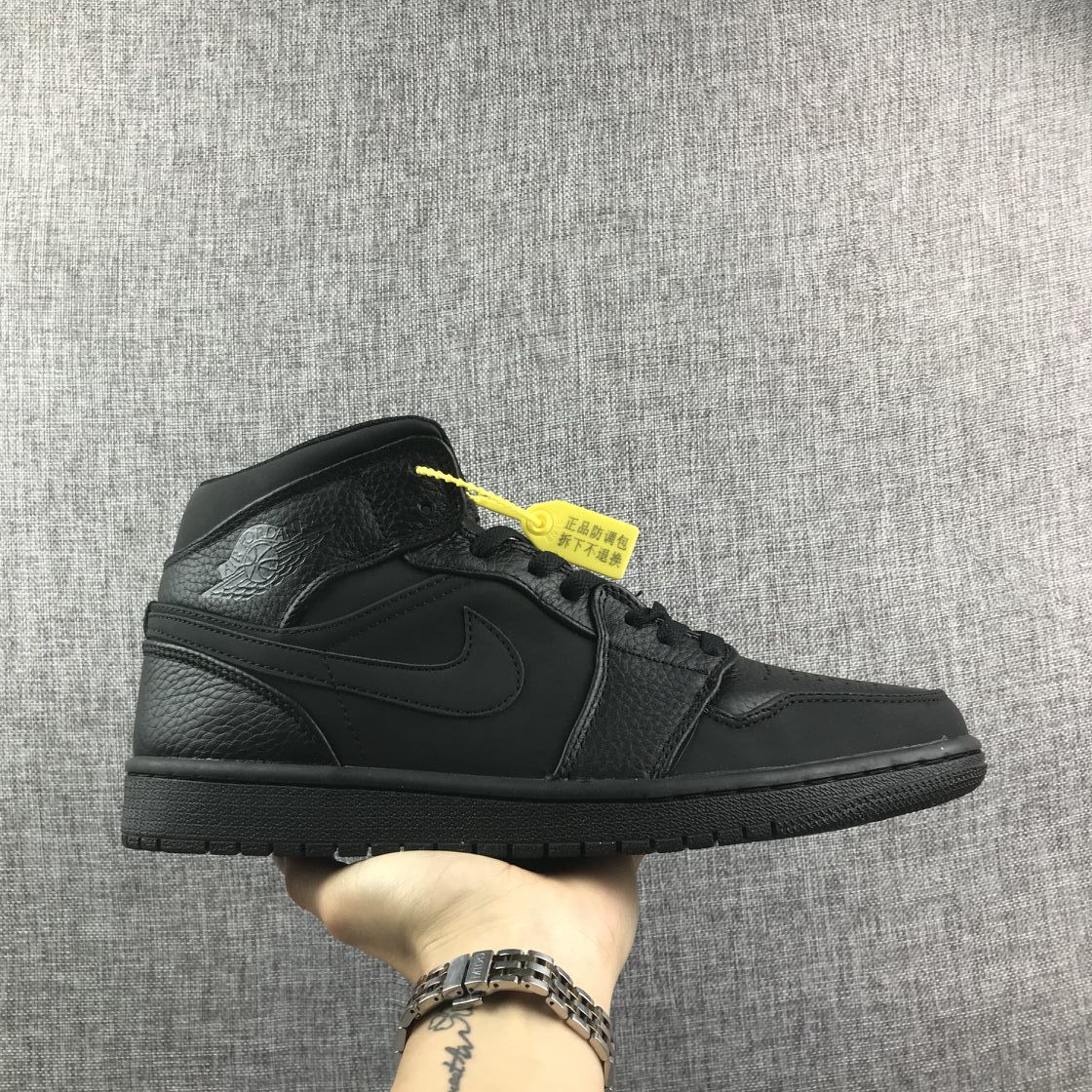 Air Jordan 1 Mid Sneakers, in Black - product image from the listing.
