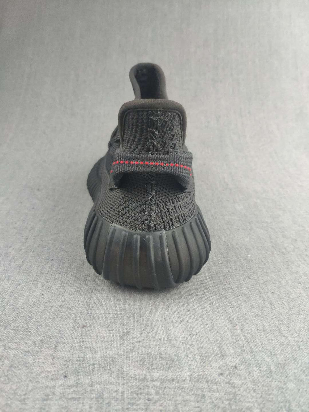 Yeezy Boost 350 V2 Sneakers in Dark Gray Knit - product image from the listing.