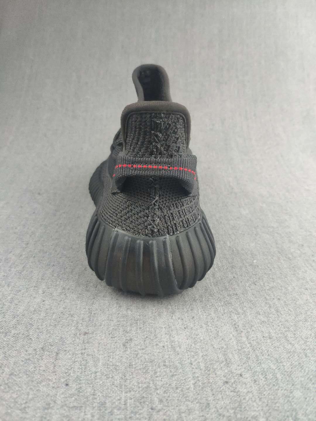 Yeezy Boost 350 V2 Sneakers in Dark Gray Knit - product image from the listing.