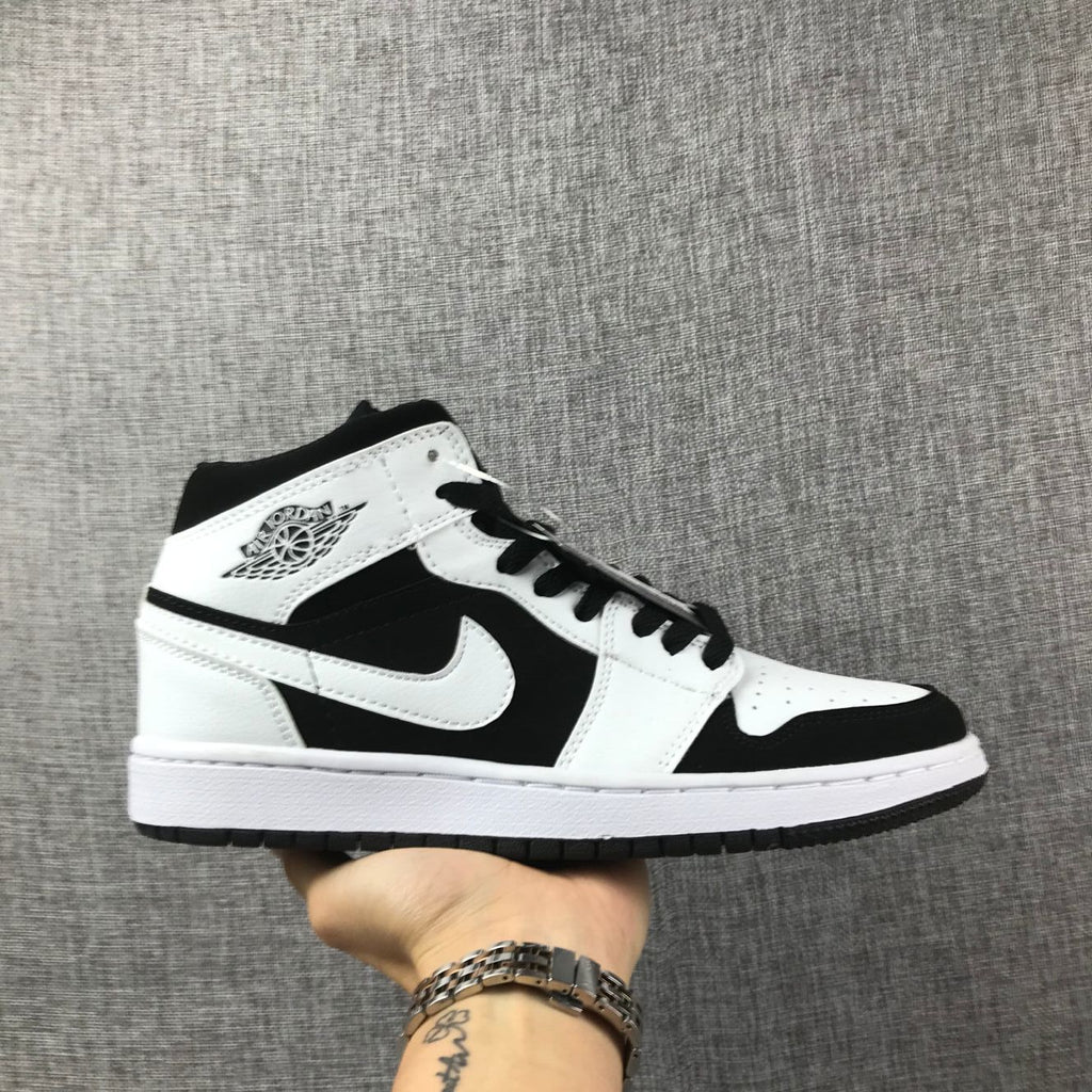 Air Jordan 1 Mid Black White Sneakers 554724-113 - product image from the listing.