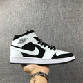 Air Jordan 1 Mid Black White Sneakers 554724-113 - product image from the listing.