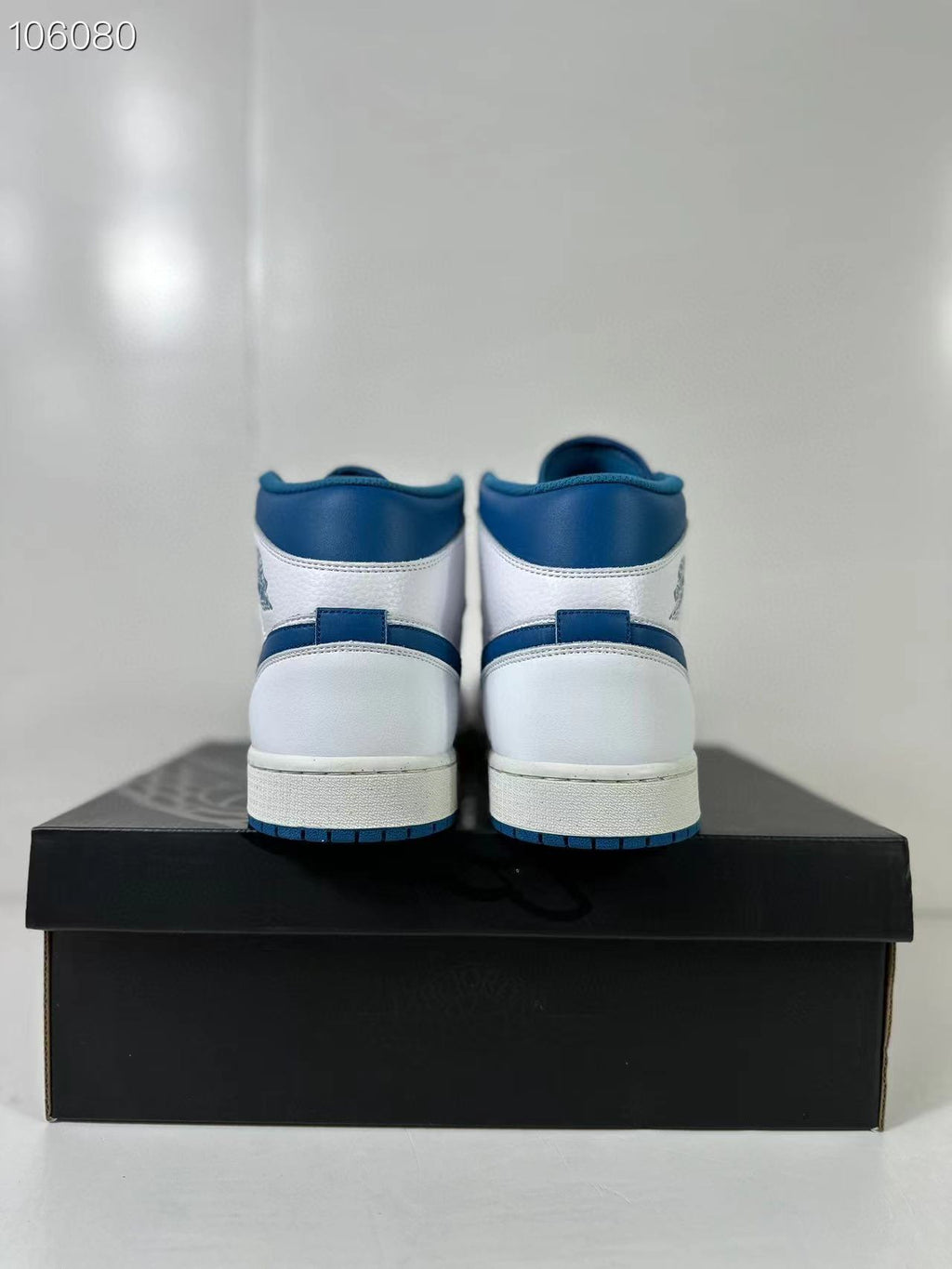 Air Jordan 1 Mid White Blue FN5215-141 Sneakers - product image from the listing.