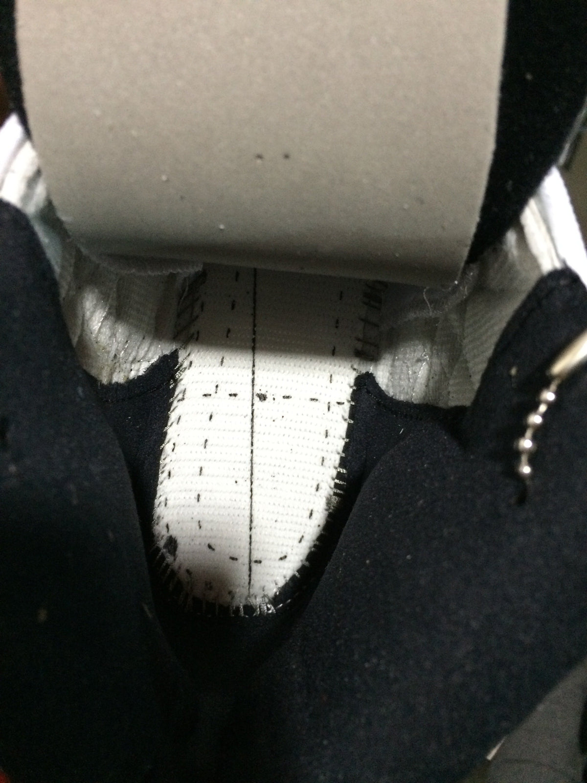 Air Jordan 12 Retro White and Black High-Top Sneakers - product image from the listing.