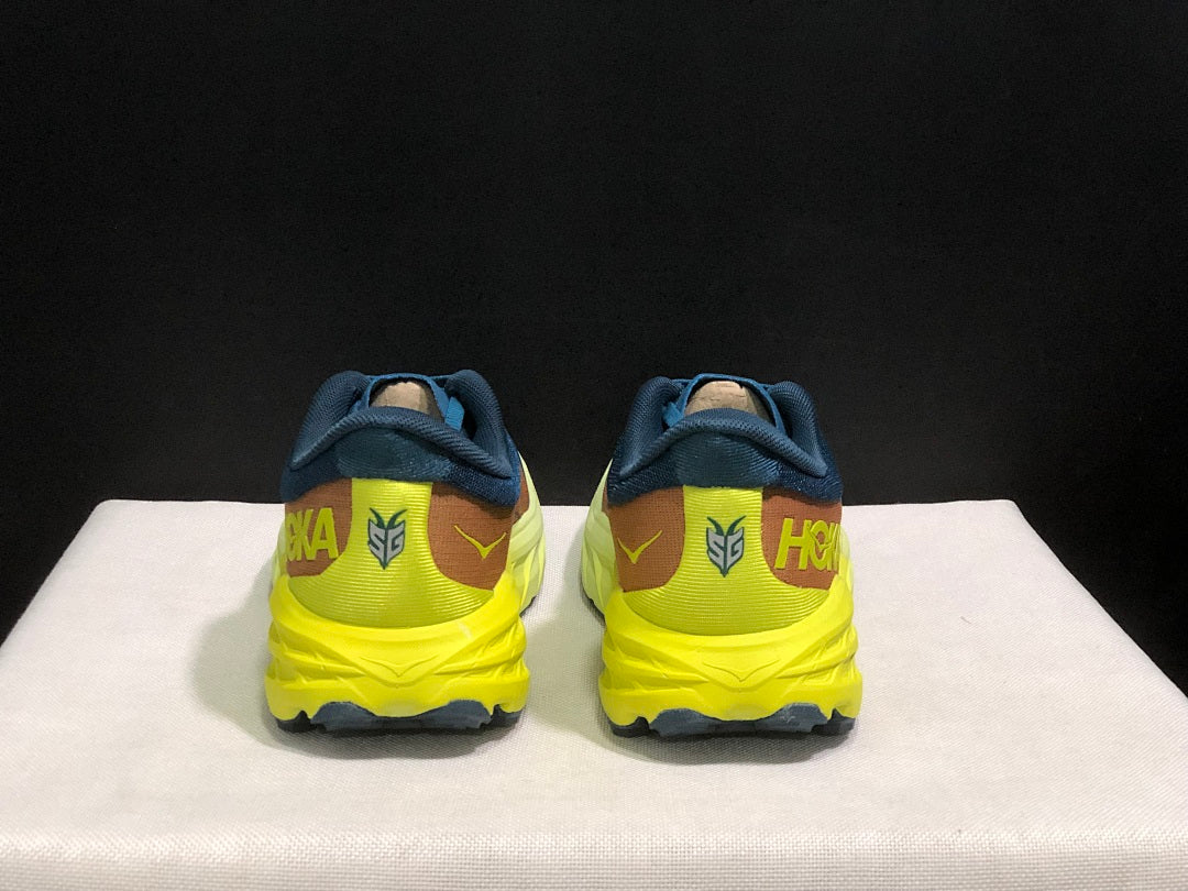 HOKA Speedgoat 6 Trail Running Shoes in Blue Yellow - product image from the listing.