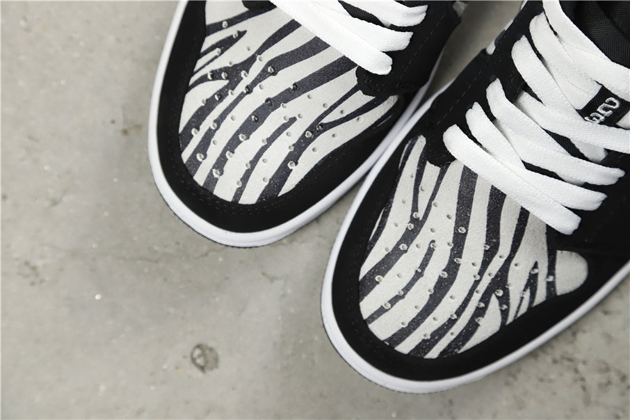 Air Jordan 1 Mid Zebra Print Sneakers Black White - product image from the listing.