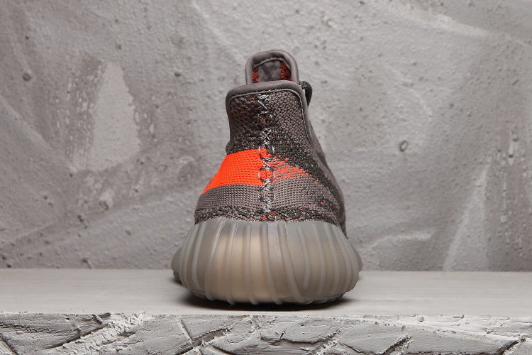 Charcoal and Bright Orange Yeezy 350 V2 Sneakers - product image from the listing.