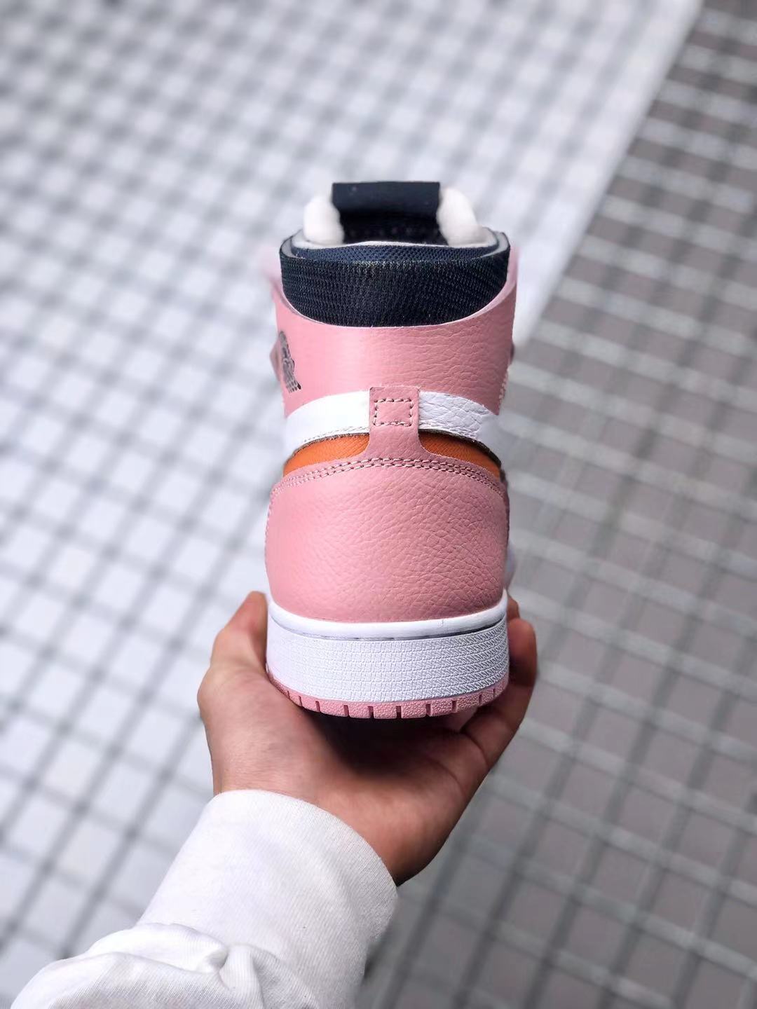 Jordan 1 High Zoom CMFT Sneakers in Pink White Orange CT0979-601 - product image from the listing.