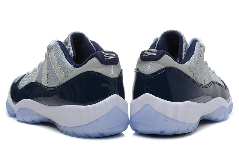 Air Jordan 11 Retro Low Sneakers, White and Navy - product image from the listing.