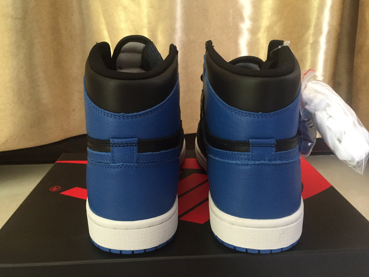 Jordan 1 High Sneakers in Black and Royal Blue - product image from the listing.