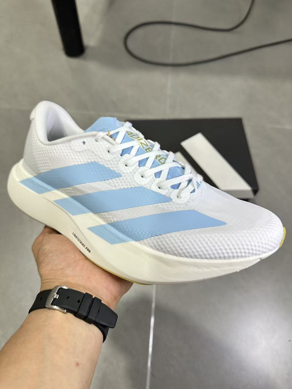 Adidas Lightstrike Pro Running Shoes in White Blue JQ4527 - product image from the listing.
