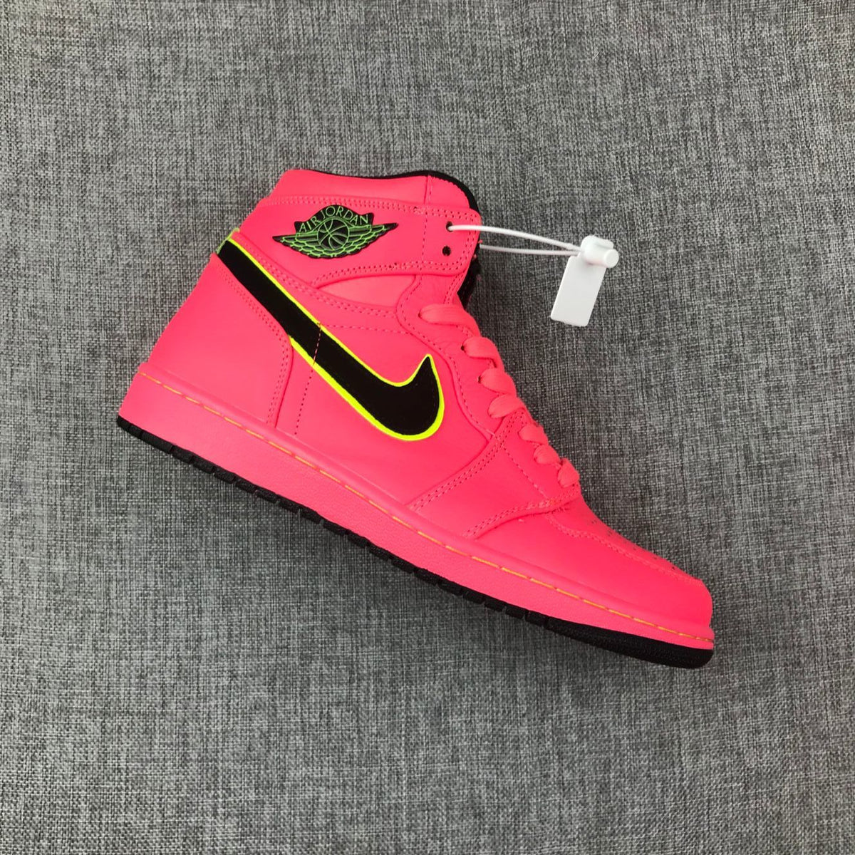 Air Jordan 1 Mid Sneakers in Pink Black Volt AQ9131-600 - product image from the listing.