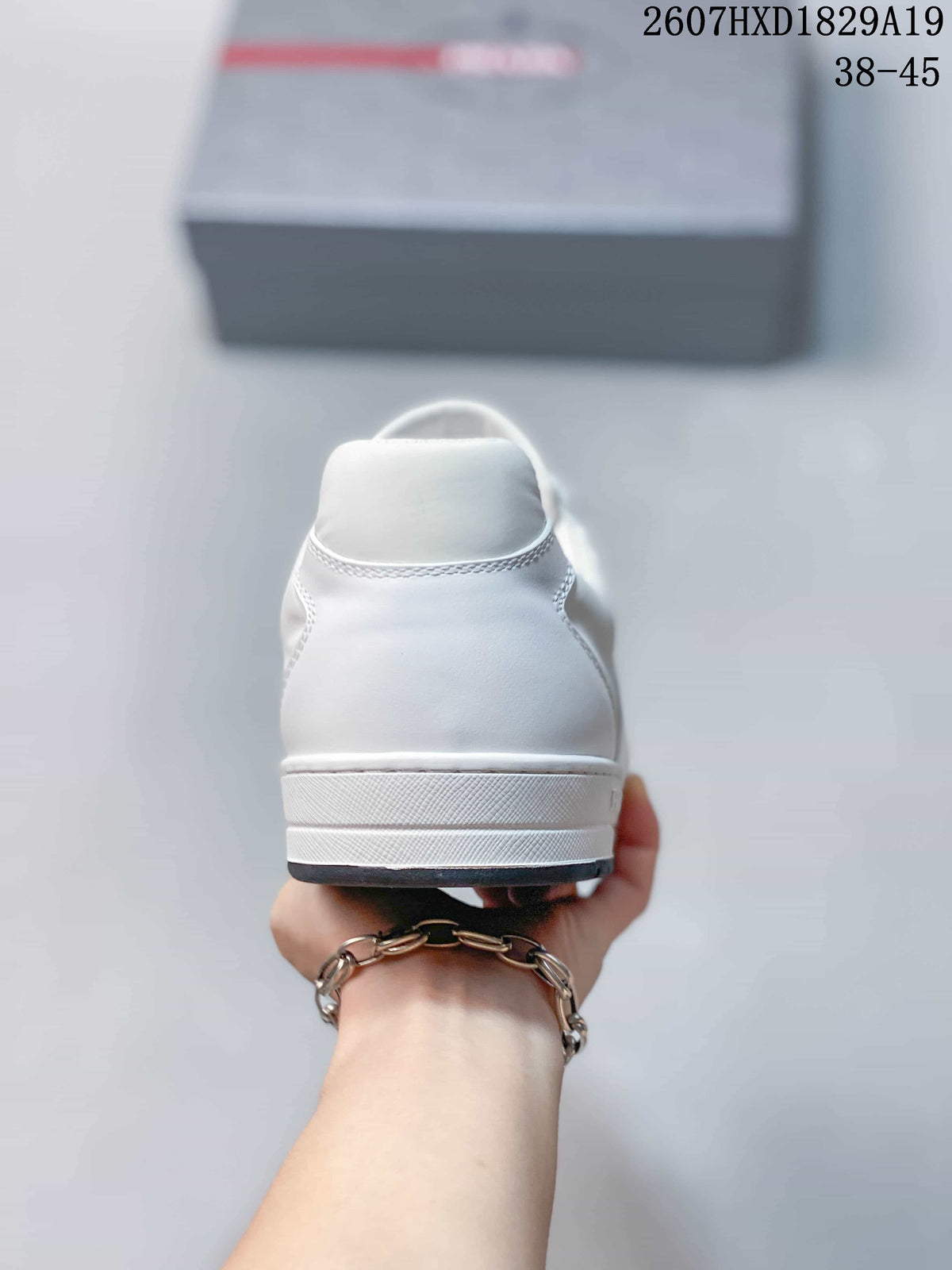 Prada Downtown Low-Top Sneakers in White Leather 2607HXD1829A19 - product image from the listing.