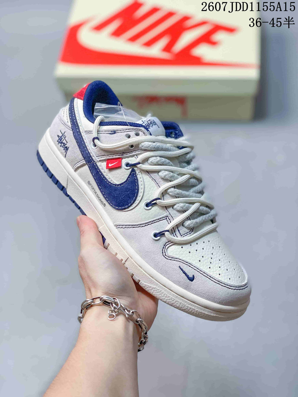 Nike SB Dunk Low Trainers in White, Gray and Navy Styles - product image from the listing.
