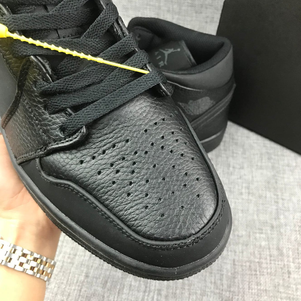Air Jordan 1 Mid Sneakers, in Black - product image from the listing.