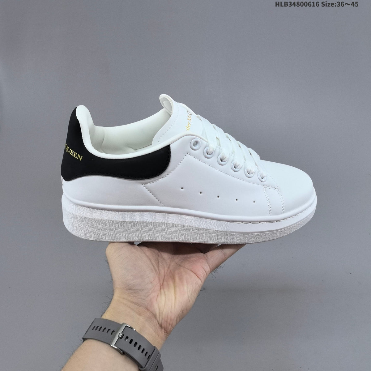 Alexander McQueen Oversized Low-Top Sneakers, in White and Black - product image from the listing.