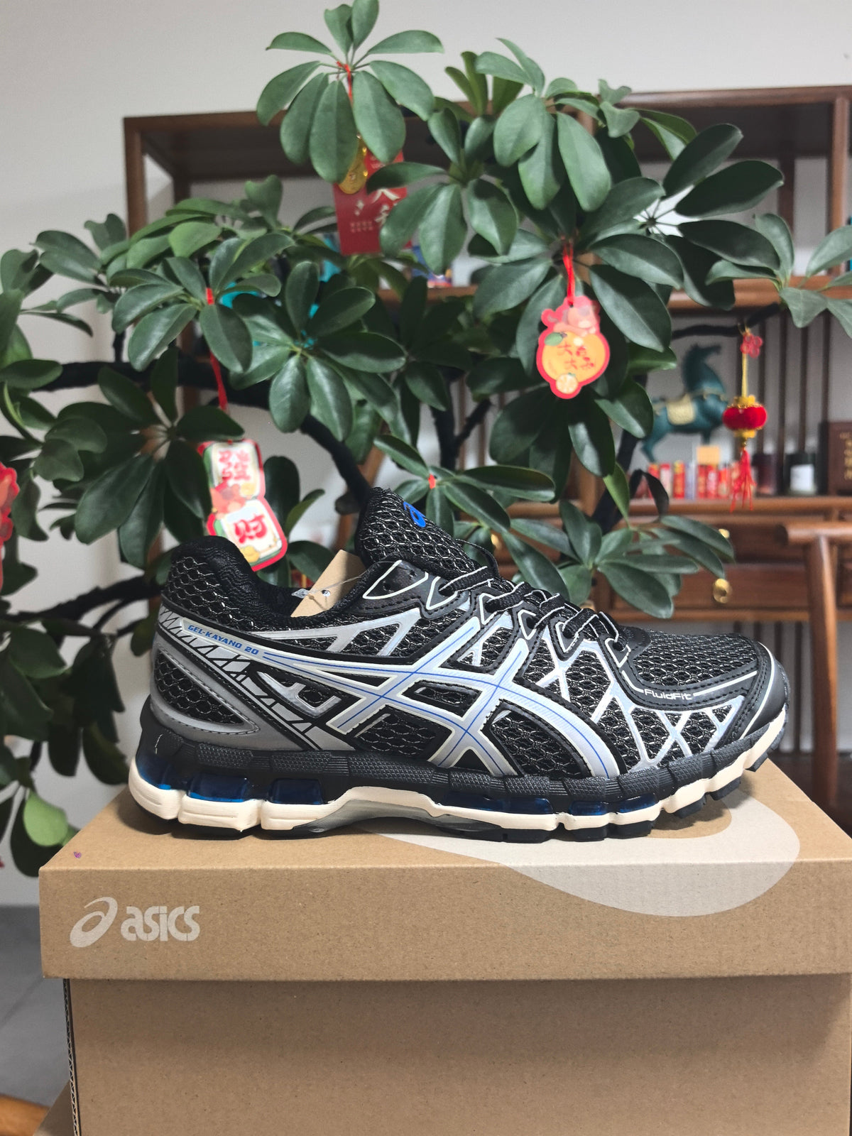 ASICS GEL-KAYANO 20 Sneakers in Black Silver Blue - product image from the listing.