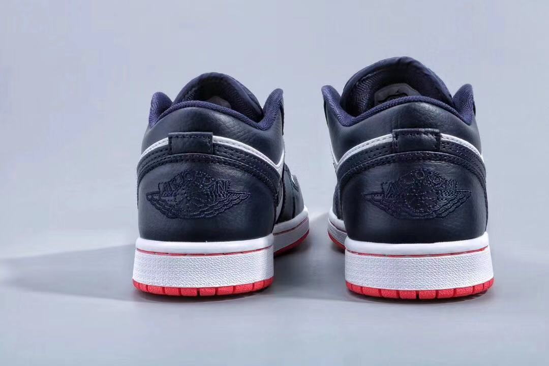 Jordan 1 Low Sneakers in Midnight Navy White Red - product image from the listing.