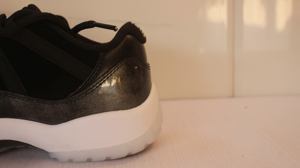 Air Jordan 11 Low Barons Black Sneakers - product image from the listing.