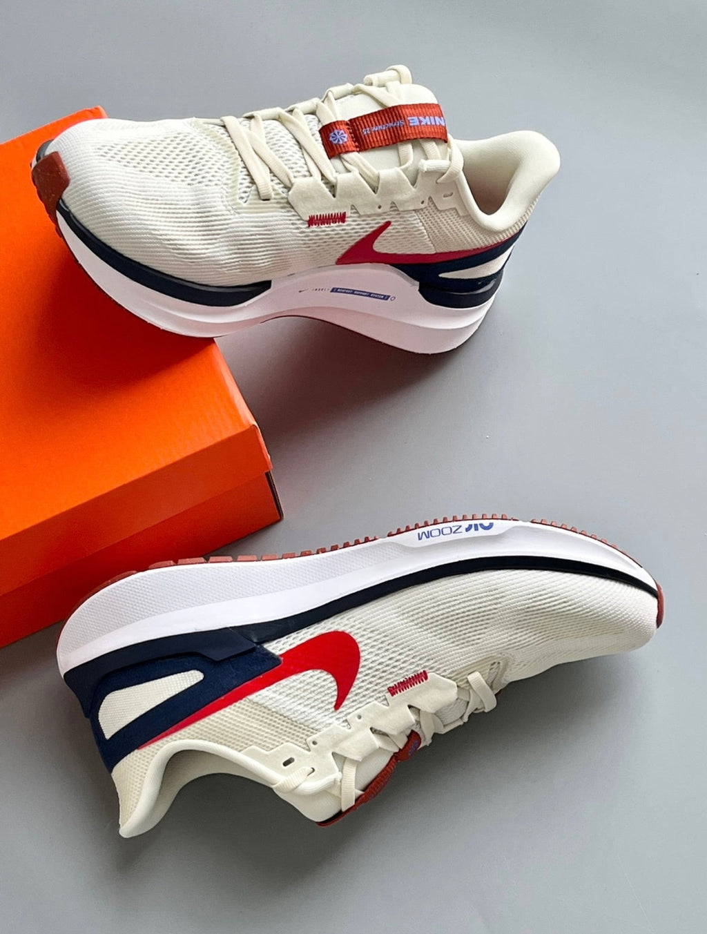 Nike Structure 25 Road Running Shoes, in Sail Red DJ7883-001 - product image from the listing.