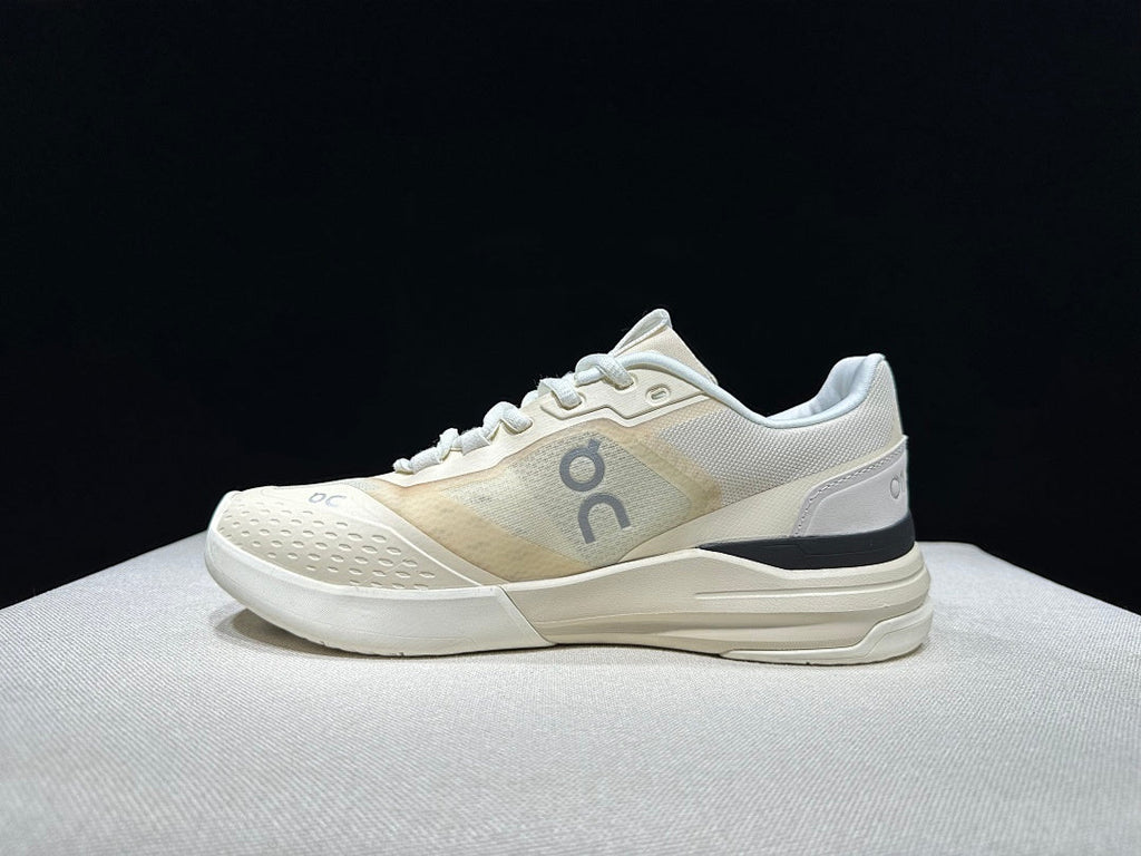 Cream and Black On The Roger Advantage Pro Sneakers - product image from the listing.