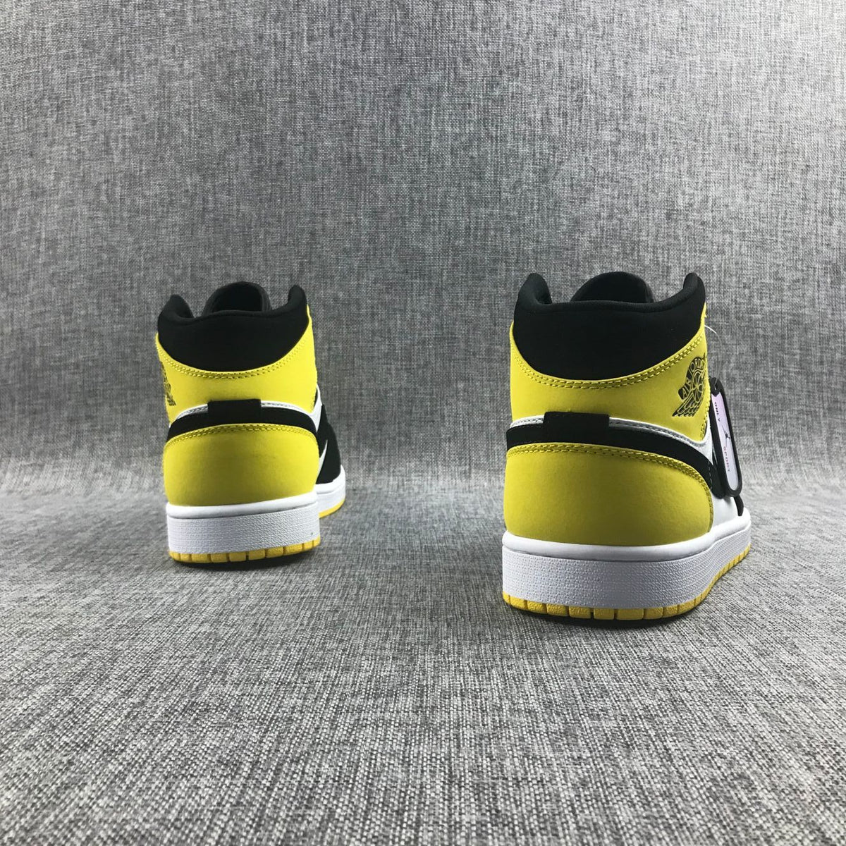 Black Yellow Toe Sneakers - Air Jordan 1 Mid SE 852542-071 - product image from the listing.
