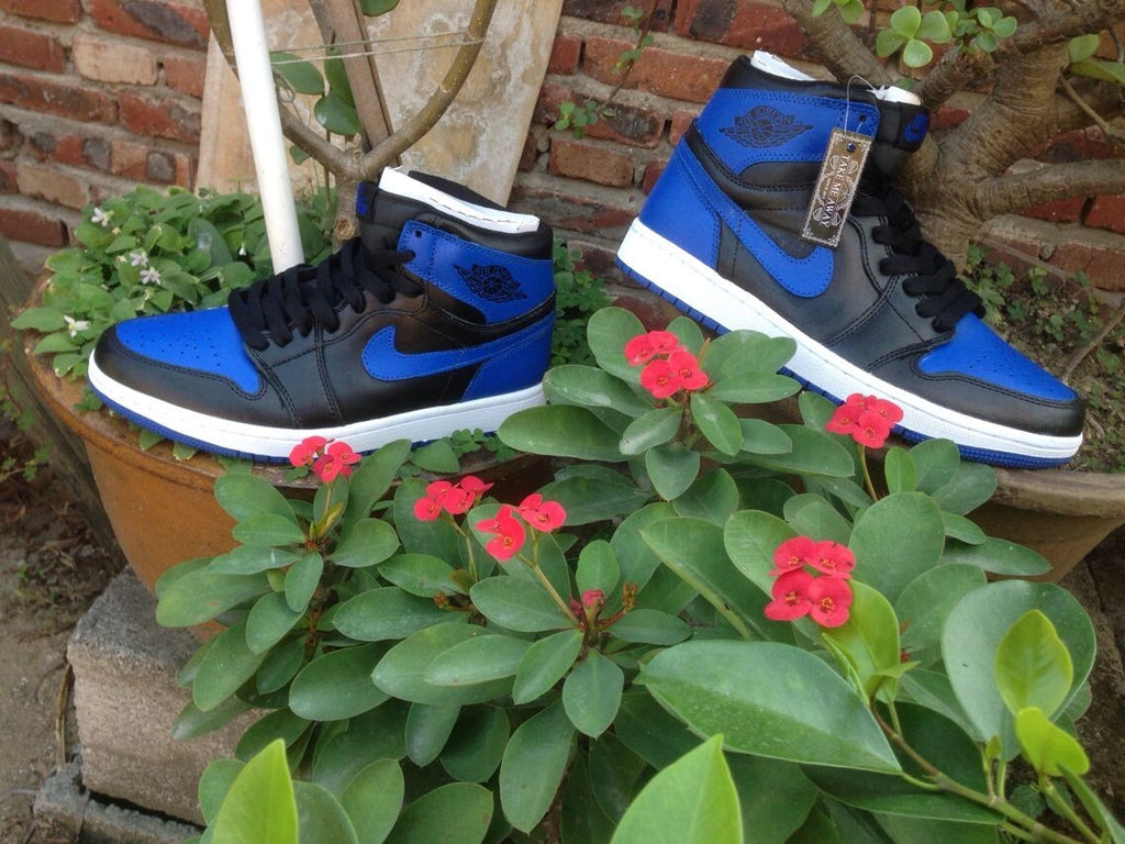 Jordan 1 High Basketball Sneakers in Blue and Black - product image from the listing.