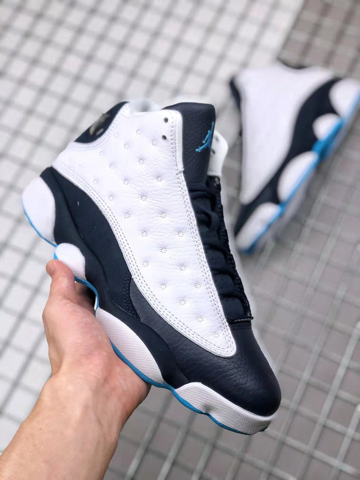 Air Jordan 13 Obsidian Sneakers 414571-144 - product image from the listing.