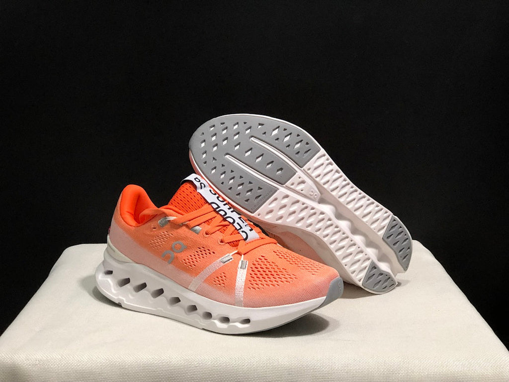 Coral and White On Cloudsurfer Running Shoes - product image from the listing.