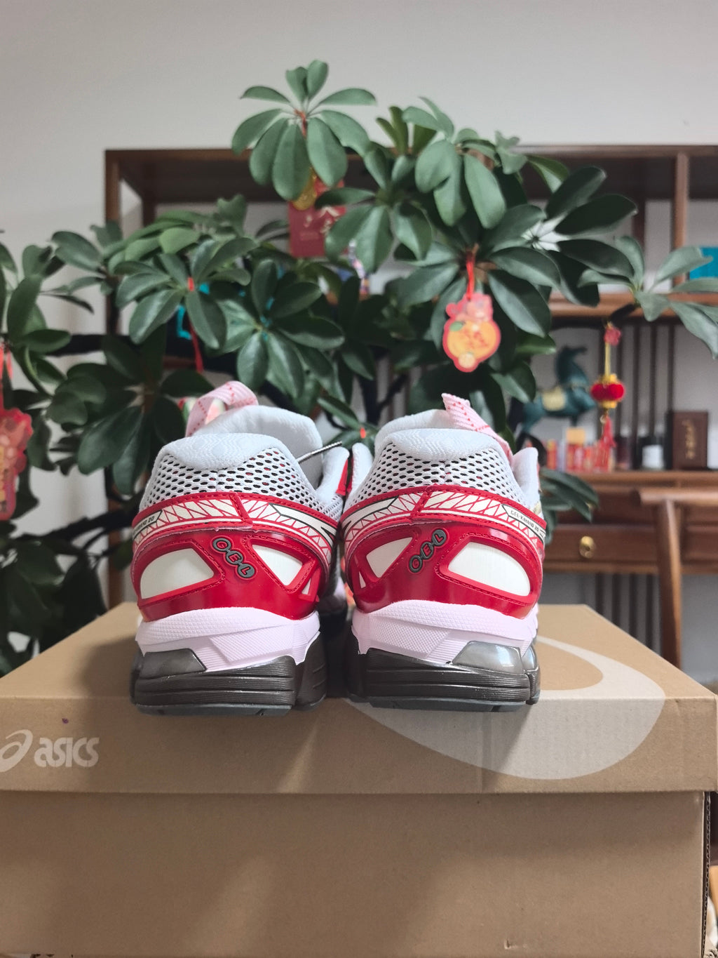 ASICS Gel-Kayano 22 Running Sneakers in White and Red - product image from the listing.