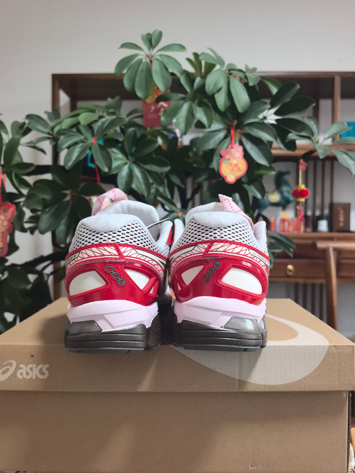 ASICS Gel-Kayano 22 Running Sneakers in White and Red - product image from the listing.