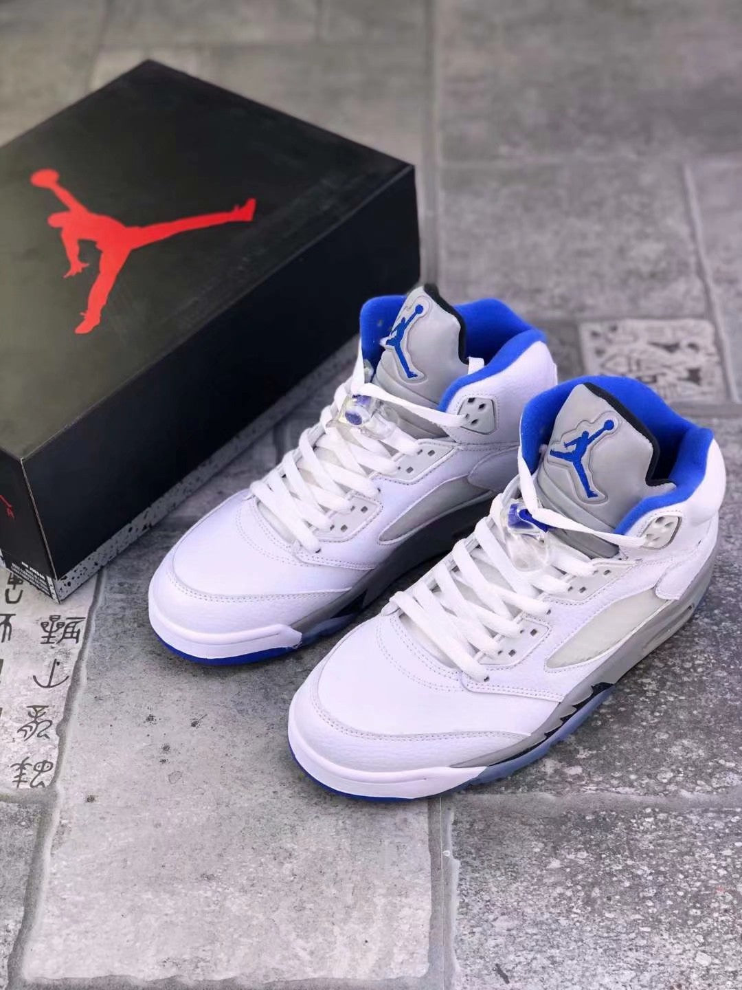 Air Jordan 5 Stealth 2.0 Sneakers in White Blue 440888-140 - product image from the listing.