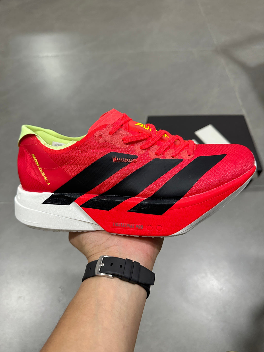 Nike Adizero Running Shoes in Red Black Volt JR6358 - product image from the listing.